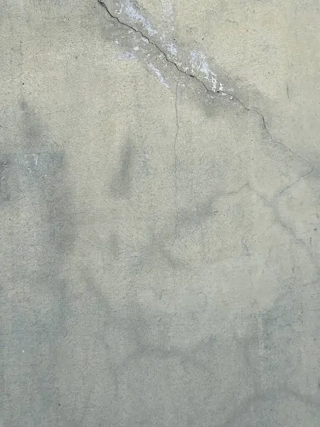 Soyut grunge gri arkaplan. Tasarım arka planı olarak kullanılabilecek zengin bir eski dokuya sahip bir duvar..