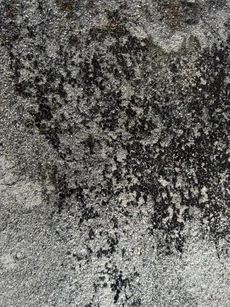 Soyut grunge gri arkaplan. Tasarım arka planı olarak kullanılabilecek zengin bir eski dokuya sahip bir duvar..