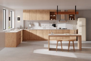 Parlak bej renkli bir mutfak. Pencereden içeri güneş ışığı giriyor..