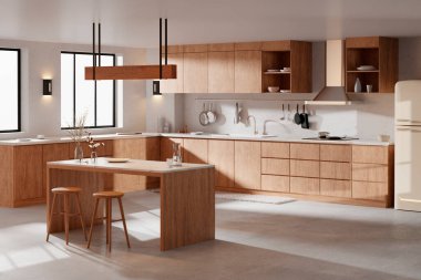 Parlak bej renkli bir mutfak. Pencereden içeri güneş ışığı giriyor..