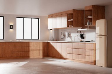 Parlak bej renkli bir mutfak. Pencereden içeri güneş ışığı giriyor..