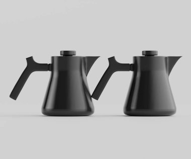Tarafsız bir zemine karşı iki modern siyah çaydanlık sergileniyor. Çaydanlıklarda parlak, geometrik şekiller ve ergonomik saplar var. Aydınlatma bile, çaydanlığın pürüzsüz, mat kısmını vurguluyor. Görüntü bir reklamcıda kullanılabilir.