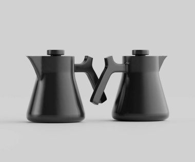 Tarafsız bir arkaplanda iki modern, mat, sade kahve demliği sergileniyor. Tasarım, pürüzsüz çizgileri olan minimalist bir tasarım ve tencerelerde farklı saplar var. Görüntü iyi aydınlatılmış, net bir görsel detay oluşturuyor. Sahne kapalı, altı çizili.