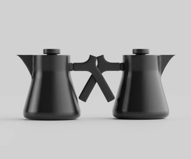 Modern tasarımı olan iki siyah çaydanlık. Çaydanlıklar siyaha boyanmış, temiz ve minimalist tarzda. Sapları benzersiz bir çapraz tasarım içeriyor. Çekici bir görsel ilgi yaratıyor. Tarafsız bir arkaplanda sunulurlar.