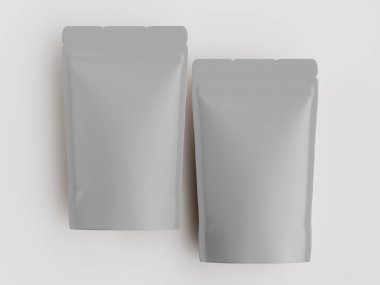 Düz beyaz arka planda iki açık gri kese sergilenir. Keseliler dik konumda. Aydınlatma eşit, ürünler üzerinde göze çarpan bir gölge bırakmıyor. Tasarım basit ve modern. Görüntü bir reklam için mükemmel.