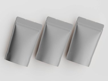 Açık gri, dikdörtgen keseler düz beyaz arka planda düz bir zeminde dizilir. Kese pürüzsüz ve hafif yansıtıcı bir maddeden yapılmış gibi görünüyor. Aydınlatma eşit, göze çarpan bir gölge bırakmıyor. Bu resim kullanmak için idealdir