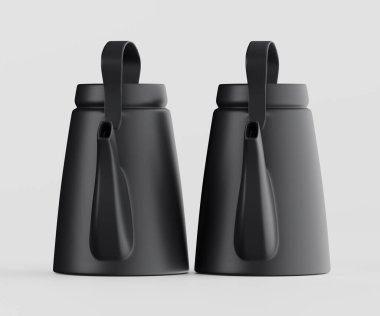 İki siyah çaydanlık açık gri arka planda yan yana sergilenir. Basit, pürüzsüz şekilleri ve aynı tutamakları olan modern görünüyorlar. Işıklandırma eşit ve nötr, tencerelerin biçimini ve dokusunu vurguluyor. Görüntü gayet iyi.