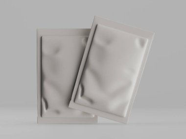 İki açık gri, katlanmış plastik paket, muhtemelen kozmetik ya da yiyecek için. Paketler pürüzsüz, buruşuk ya da buruşuk bir dokusu var. Stüdyo ortamında sade ve nötr bir altyapıya sahipler. Resim ambalaj des için kullanılabilir