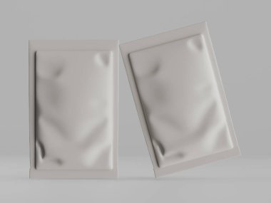 Stüdyo çekiminde iki boş, açık gri folyo kesesi ya da paket sunuluyor. Kesesinde hafif buruşuk ya da buruşuk bir doku var ve ışıklandırma eşit. Tarafsız gri bir arkaplanda sıralanmışlar. Resim resimleme için uygundur