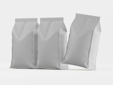 Stüdyo çekimlerinde üç adet açık gri, boş yiyecek ambalajı, stil ve form olarak benzer şekilde gösteriliyor. Çantalar açık gri bir yüzey üzerinde yüzer gibi sunuluyor. Perspektif açık ve aydınlatma eşit, temiz bir estetik yaratıyor