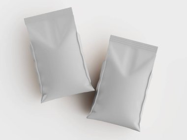 İki açık gri, boş, besin ambalajı torbası, yukarıdan beyaz bir yüzeyden görünüyor. Çantalar dikdörtgen ve pürüzsüz, mat bir dokusu var. Aydınlatma parlak ve eşit, belirgin bir gölge bırakmıyor. Resim gösterim paketi için uygundur