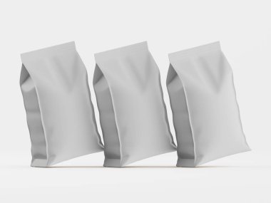 Üç tane boş, açık gri kağıt yemek torbası modern ürün fotoğrafçılığı tarzında sergileniyor. Çantalar hafif çapraz bir çizgide dizilmiş ve yüzüyor gibi görünüyor. Bu da hafif ve havadar bir kaliteye işaret ediyor. Torbaların yumuşak, mat bir dokusu var.