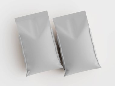 Açık gri, boş, mühürlü iki kese parlak beyaz bir yüzey üzerinde duruyor. Parlak ışık altında keseler pürüzsüz ve modern görünüyor. Görüntü ürün katalogları, tanıtım materyalleri veya ambalaj tasarımı için idealdir..