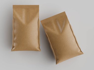 Açık gri bir yüzey üzerinde iki açık kahverengi kağıt kese sergilenir. Keseler benzer şekil ve boyutta ve pürüzsüz bir dokuya sahipler. Aydınlatma düz ve tepede, güçlü gölgeler yaratmıyor. Görüntü ticari kullanım için uygundur