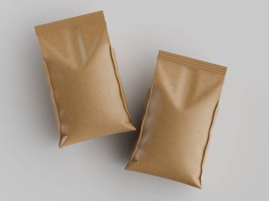 Açık kahverengi, kağıt gibi iki kese açık gri bir yüzey üzerinde duruyor. Kese pürüzsüz, parlak bir kapak ve basit bir tasarım sergiliyor. Görüntü iyi aydınlatılmış ve doğrudan yukarıdan alınarak keselerin net bir görünümü sağlanıyor. Bir kişi için uygun.