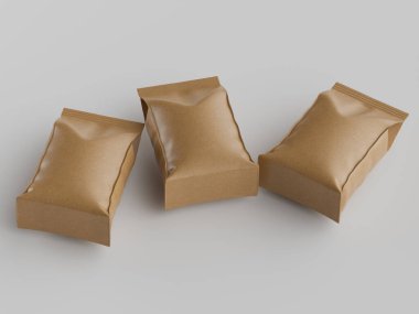 Üç açık kahverengimsi kahverengi kesesi, muhtemelen atıştırmalık yiyecekler için, nötr gri bir yüzey üzerinde hafifçe yükseltilmiş, çapraz bir düzende sergilenmektedir. Pürüzsüz görünüyor, muhtemelen plastik ya da folyoyla kaplanmış kağıt. Işıklar eşit ve parlak, Cre.