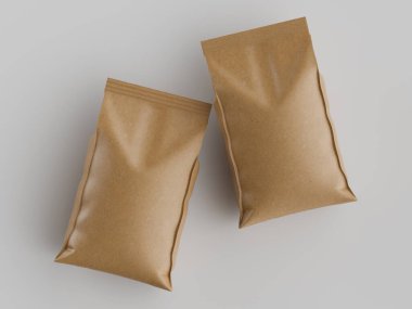 Açık kahverengi, kağıda benzeyen iki paket torbası nötr, açık gri bir zeminde düz bir zeminde dizilir. Çantalar mühürlü ve pürüzsüz görünüyor. Işıklandırma, çantaların dokusunu belirginleştiriyor ve kapalı bir stüdyo ortamını işaret ediyor. Sho için ideal.