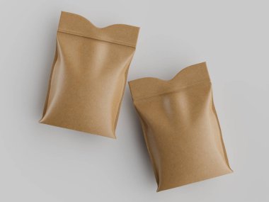 Atıştırmalıklar veya benzer gıda ürünleri için iki açık kahverengi kese kağıdı, düz bir doku sergileyerek yüksek açıyla gösterilir. Çantaların üstü hafif kıvrımlı ve köşegen olarak nötr gri bir yüzeye yerleştirilmiştir. Aydınlatma dengeli.