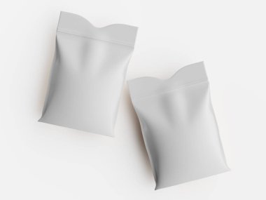 İki beyaz, dikdörtgen paket düz ve açık bir arkaplanda sunuluyor. Paketlerin hafif kıvrımları yumuşak içeriği ve katlanmış üst kenarı gösteriyor. Sahne ışıkla aydınlatılmış, yayılmış ışık, yumuşak gölgeler... 