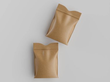 Açık kahverengimsi iki kağıt ya da karton keseler soluk gri arka planda sergilenir. Keseler dikdörtgen şeklinde ve pürüzsüz, hafif parlak bir yüzeye sahipler. Yukarıdaki stüdyoda çekiliyor. İçeriden çekildiğini gösteriyor.