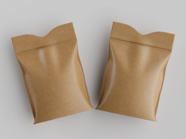 İki açık kahverengimsi kağıt ya da plastik torbalar tarafsız gri arka planda sergilenir. Torbaların pürüzsüz, hafif parlak bir dokusu var. Şekilleri dikdörtgendir ve üst kenarları yumuşak kıvrımlıdır. Birbirlerine paralel konumdalar, merkezde.