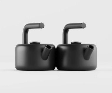 İki modern, mat siyah çaydanlık, açık gri arkaplan üzerine kurulmuş kapalı bir stüdyoda sunuluyor. Basit, geometrik tasarım yuvarlak formlar ve pürüzsüz yüzeylerle karakterize edilir. Çaydanlıklar minimalist bir estetiğe sahiptir ve konumlandırılmışlardır.