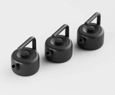 Üç özdeş mat siyah çaydanlık düz açık gri arkaplan karşısında yatay bir sırada sergilenir. Çaydanlıkların sade ve yuvarlak bir tasarımı var. Aydınlatma eşit, ve çekim stüdyo çekimi, temiz, uncluttere ile