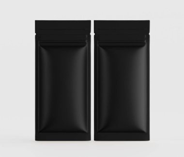 İki özdeş, siyah, esnek ambalaj kesesi sade ve nötr bir arkaplana karşı sergileniyor. Torbaların pürüzsüz, mat bir sonu var. Şekilleri dikdörtgen ve çeşitli nesneleri depolamak için tasarlanmış gibi görünüyorlar. Kese oryantasyonu var.