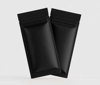 Açık gri arkaplana karşı iki siyah, mat, folyo kesesi sunuluyor. Keselerin dikdörtgen şeklinde, düzgün ve düzgün bir dokusu var ve mühürlüler. Görüntü tarzı son derece detaylı ve profesyoneldir, bu da promosyon veya halkla ilişkiler anlamına gelir.