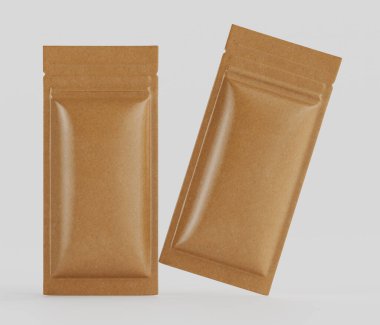 Açık kahverengi, dikdörtgen, folyoya sarılı iki paket tarafsız bir arkaplanda sergileniyor. Paketleme malzemesi pürüzsüz ve parlak, yansıtıcı bir filmle kaplanmış bir kağıt ya da karton gibi görünüyor. Paketler bir s 'de konumlandırıldı