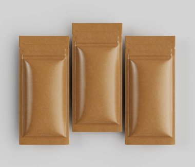 Açık kahverengi, dikdörtgen keseler, nötr bir arkaplanda yatay sırada dizilir. Kese pürüzsüz, hafif parlak bir maddeden yapılmış gibi görünüyor. Bu da koruyucu gıda ambalajı olduğunu gösteriyor. Çantaların basit bir tasarımı var. 