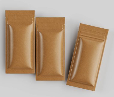 Açık kahverengi kağıt yemek kesesi, açık gri bir yüzeye serilmiş. Keseler dikdörtgen şeklinde ve parlak, pürüzsüz bir dokusu var. Tarzı minimalist, ışıklandırma ise eşit, belirgin bir gölge yaratmıyor. Ayarlar bir...