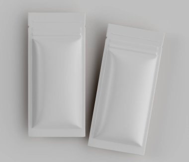 İki boş, beyaz, dikdörtgen çanta ya da paket yukarıdan, yüksek açılı perspektiften gösteriliyor. Kese pürüzsüz ve parlak bir maddeden yapılmış gibi görünüyor. Bu tarz modern ve minimalist, yiyecek ambalajı için uygun. Arka plan...