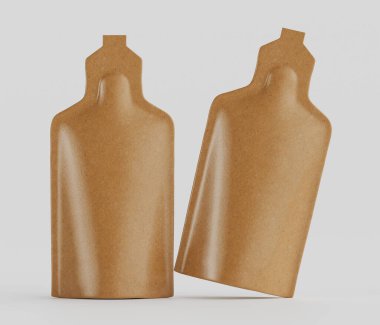 Bir stüdyo ortamında, şekil ve boyut olarak benzer iki açık kahverengi kesesi sunuluyor. Poşetler pürüzsüz ve parlak, bu da plastik veya folyo gibi esnek bir maddeyi akla getiriyor. Hafif açılı bir pozisyondalar, derinlik ve dimen yaratıyorlar.