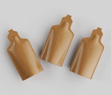 Üç ayrı, açık kahverengi, esnek kesesi açık gri arka planda hafifçe üst üste dizilmiş. Keselerin şekli tutarlı, küçük şişe ya da ampulleri andırıyor. Dar bir boynu ve hafif bir alevi var.