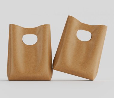 Bir stüdyo ortamında pürüzsüz bir yüzey sergileyen açık kahverengimsi iki kese kağıdı sunulur. Poşetler, tarafsız açık gri bir arkaplanın üzerinde süzüldüklerini gösteren bir şekilde yerleştirilmiş. Çantalar basit tasarlanmış, featuri.