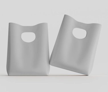 Açık gri renkli iki poşet, açık gri arka planda sunuluyor. Çantalar genel bir perspektiften tasvir ediliyor ve üç boyutlu bir tasarım ya da stüdyo düzeneği gibi görünüyor. Basit, dikdörtgen ve hafif bir kıvrımları var. 