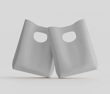 Bir çift boş, açık gri plastik torba, sade ve nötr bir zemine karşı sunuluyor. Çantalar açık, şekillerini ve yapısal tasarımlarını gösteriyor. Yumuşak ışık ve minimalist stil, temiz ve modern bir estetik olduğunu gösteriyor.