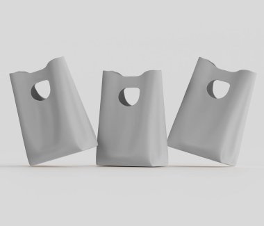 Üç adet açık gri plastik alışveriş torbası 3 boyutlu olarak gösteriliyor. Çantalar, tarafsız bir arkaplana karşı dinamik ve hafifçe açılı bir şekilde yerleştirilmiş. Modern ve basit görünüyorlar. Kolayca kavrayabilmek için kesme ya da delik tasarlıyorlar. Şey...