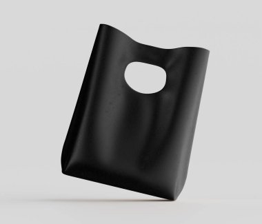 Tarafsız gri arka planda siyah plastik bir alışveriş torbası sergileniyor. Çanta dörtte üç açıyla yerleştirilmiş, hafifçe açılı ve havada süzülüyor gibi görünüyor. Poşet pürüzsüz, mat bir son gösteriyor, ve basit bir istek sergiliyor