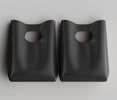 Tarafsız bir arkaplana karşı aynı koyu renkli iki çanta sunuluyor. Çantalar biraz daha yüksek bir açıdan bakılıyor, şekillerini ve tasarımlarını vurguluyorlar. Torbaların pürüzsüz dokusu ve kıvrımlı kenarları ışıklandırmayla vurgulanıyor. Bu c
