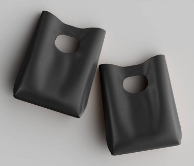 Tarafsız bir arkaplanda iki koyu renkli, stilize çanta tasvir edilir. Poşetlerde pürüzsüz bir doku ve sapı açık kıvrımlı bir üst var. Işık yumuşak görünüyor, nesnelerin şeklini vurguluyor. Kompozisyona göre bir stüdyo.