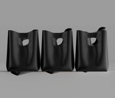Sade ve tarafsız bir arkaplanda duran üç siyah çanta birbirinin tıpatıp aynısı. Çantalar eşsiz bir kesme sapı tasarımı içeriyor, ayırt edici bir görsel element yaratıyor. Görüntü yumuşak ışıklandırmayla bestelenmiş, materyalin dokusunu vurguluyor.