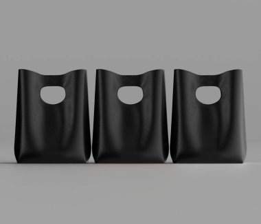 Tarafsız gri bir zemine karşı üç özdeş, katı siyah alışveriş torbası sunuluyor. Çantalar eşsiz bir kulp tasarımı içeriyor, üstte bir kesit oluşturuyor. Işıklandırma eşit, minimum gölgeler üretiyor ve pürüzsüz yüzeyi vurguluyor.