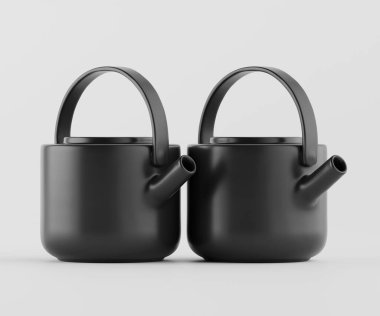 Açık gri arka planda iki siyah çaydanlık sunuluyor. Tencereler pürüzsüz, yuvarlak ve basit, yuvarlak sapları var. Genel stili modern ve minimalist. Aydınlatma düz ve parlak, parlak şekilleri ve koyu renkleri vurguluyor. 
