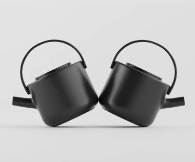 İki siyah çaydanlık simetrik olarak tarafsız bir arkaplanda konumlandırılmıştır. Çaydanlıkların bir mat finişi, yuvarlak şekilleri ve ergonomik olarak dizayn edilmiş kulpları ve çıkıntıları var. Aydınlatma düz ve yumuşak, pürüzsüz yüzeyleri vurguluyor ve m