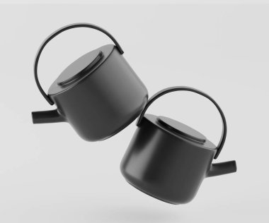 İki modern siyah çaydanlık, bir stüdyo ortamında hazırlanmış, tarafsız gri arka planda havada asılı duruyor. Çaydanlıkların çağdaş bir tasarımı, yuvarlak şekilleri ve basit sapları var. Aydınlatma, tencerelerin pürüzsüz yüzeyini ve...