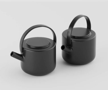 İki siyah seramik çaydanlık, açık gri bir zemine karşı sergileniyor. Tencereler pürüzsüz, yuvarlak yüzeyli ve aynı siyah saplı. Basit ve temiz çizgileri var ve tasarımda modern görünüyorlar. Işıklar eşit ve yüksek.