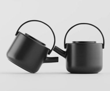 Açık gri arka planda iki siyah çaydanlık sunuluyor. Çaydanlıklar yuvarlak şekilli ve basit kulplu modern, minimalist bir tasarıma sahiptir. Kumaş pürüzsüz ve mat görünüyor, tutarlı bir tek renk tonuyla. Tencereler sli.