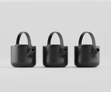 Üç mat siyah seramik çaydanlık açık gri arkaplana karşı yatay bir çizgide dizilir. Çaydanlıklar basit, modern bir tasarım. Kısa, kare gövdeleri, aynı kulpları ve çıkıntıları var. Görüntü iyi aydınlatılmış, sert bir ses çıkarmıyor.